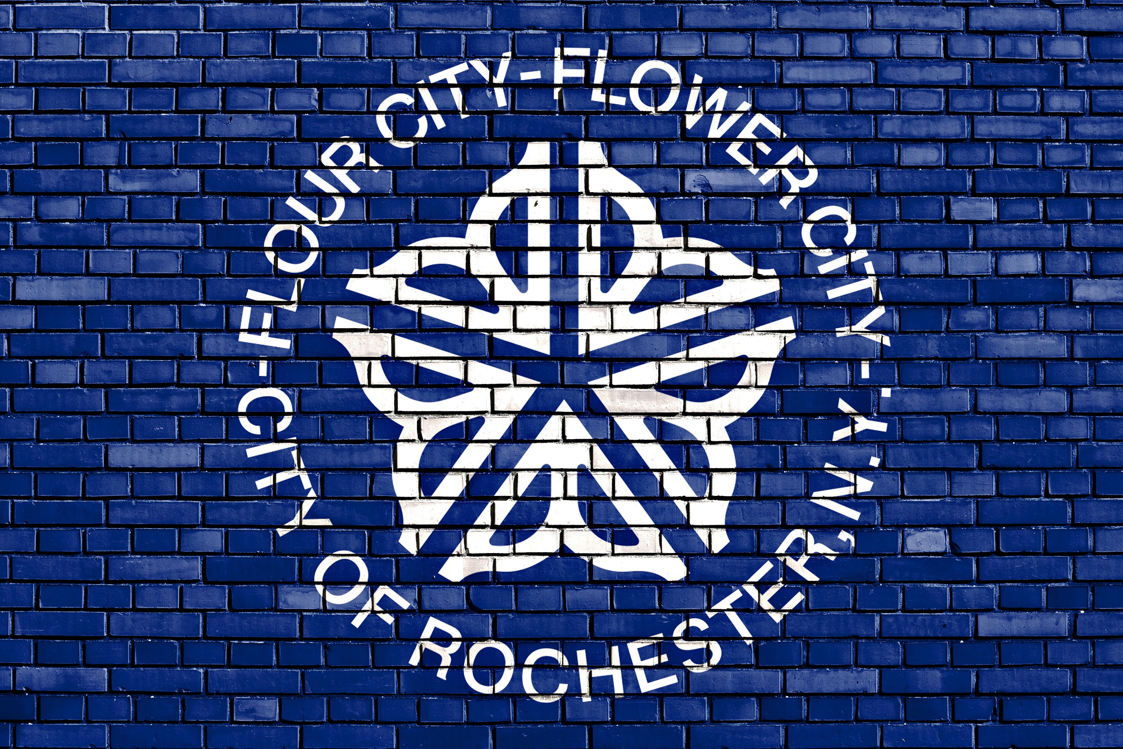 flag of Rochester painted on brick wall