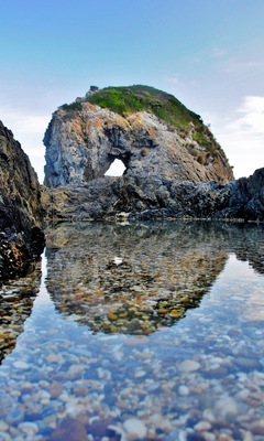 I saw a photograph once, way better than this one, and decided I had to find out where it was.
Well, first up, it's not that easy to get there for a start. You either have to scramble down a corroding cliff or make your way around at low tide from the south (which is what most people do). Be prepared to get a little wet.
If the surf's up, forget it; it's way too dangerous, but if you get the right conditions, it's definitely worth a look.