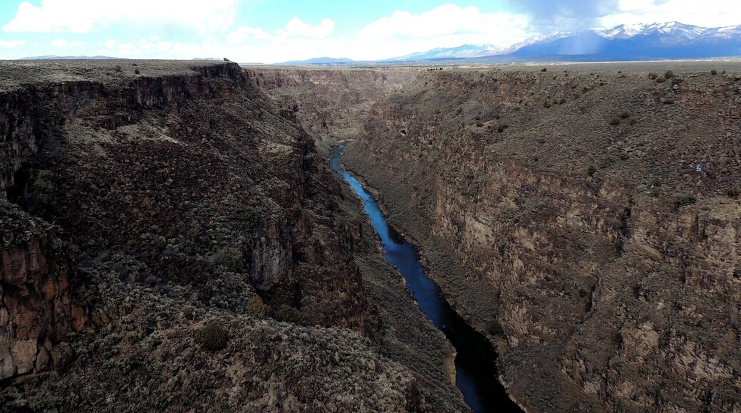 Americaâs 4th longest river, the Rio Grande, sits at the bottom of this 800-foot deep gorge, part of the Taos Plateau volcanic field in New Mexico.
The magnificent view of this National Monument and the rift valley created some twenty-nine million years ago is courtesy of the Rio Grande Gorge Bridge.
Allow 20-30 minutes to check out the magnificent views as well as the state park adjacent to the bridge and gorge. There are no bridge tolls and no fees to enter the state park. It was all amazing.