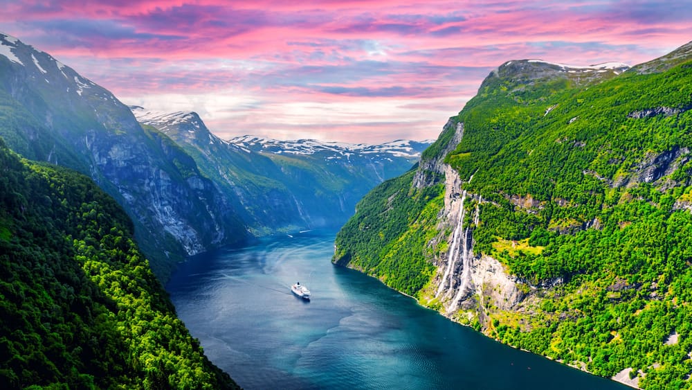 Panorama of breathtaking view of Sunnylvsfjorden fjord and famous Seven Sisters waterfalls, near Geiranger village in western Norway. Landscape photography