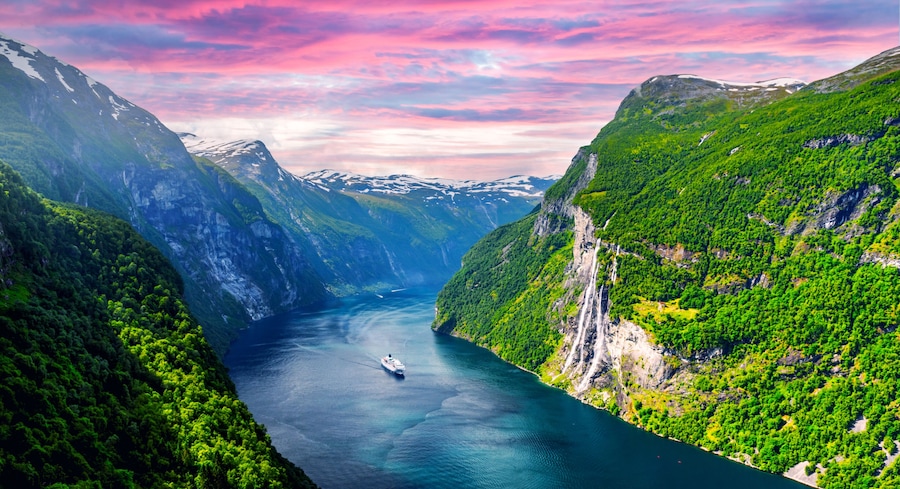 Panorama of breathtaking view of Sunnylvsfjorden fjord and famous Seven Sisters waterfalls, near Geiranger village in western Norway. Landscape photography