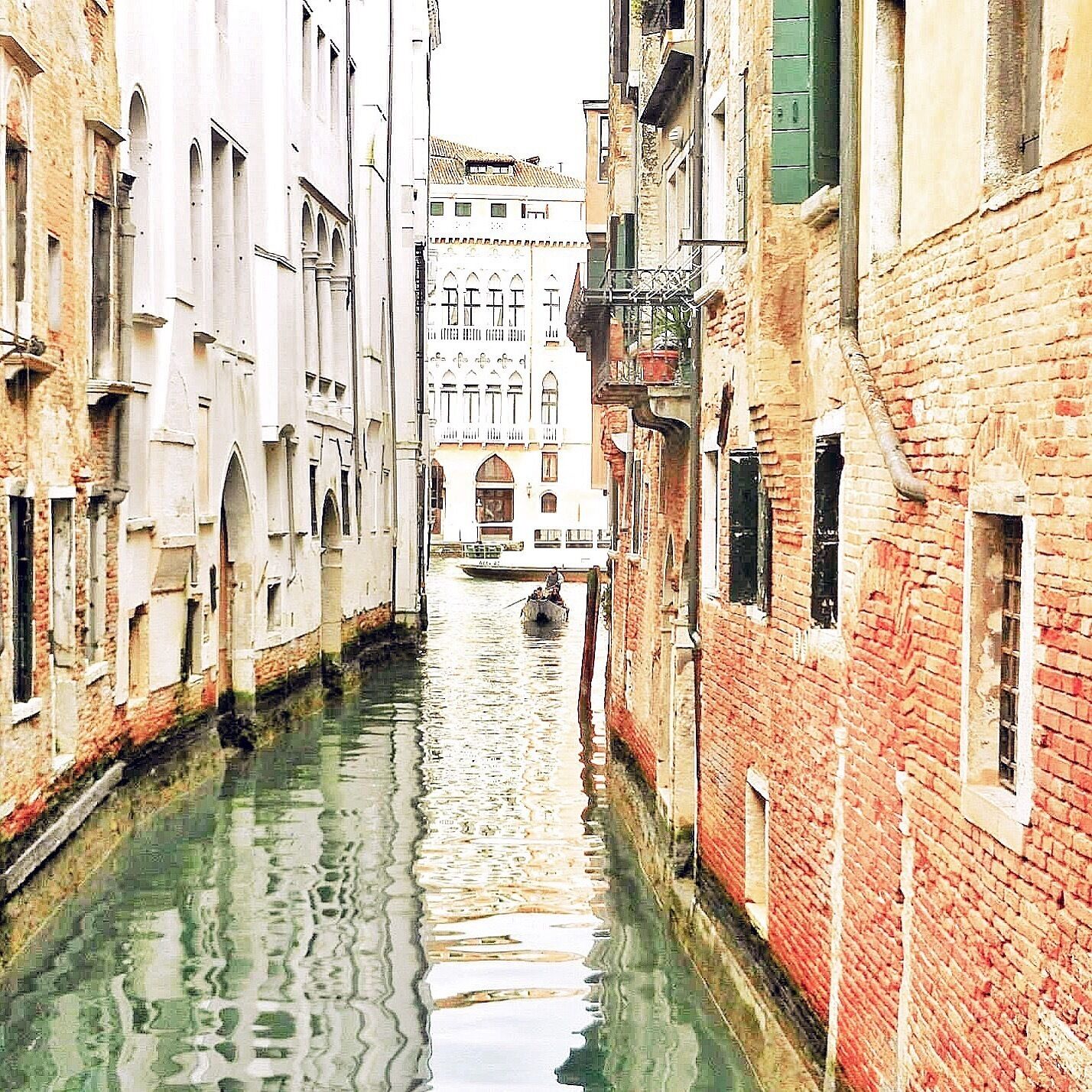 Venice, Italy canal views 😍waiting for my gondola💕🛶
•
•
•
Top 3 things I remember most about Venice: 
1. The fun water taxi rides! I miss those, especially the ones that have an open area in the back. 
2. Loosing the most important carry on ever- it had my passport, cash and copies of all my hotel itineraries. 😂Thank god for Fabio (really that was his name) for finding it and returning it home safe and sound. 
3. How beautiful it looked at night. The lights were mirrored in the water and the city was well & alive with vendors, ice cream and shops open late! •
•
•
I went during winter and thought the city was amazing but I hear the water makes it a little stinky during the summer. •
•
•
Is Venice, Italy on your bucket list? 