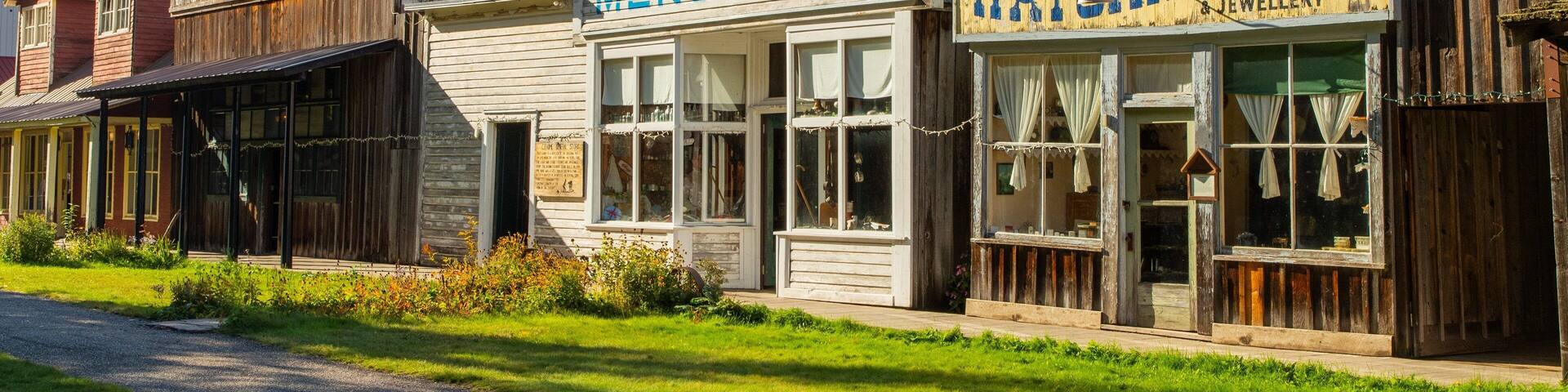 Three Valley Gap Ghost Town featuring a small town or village and signage