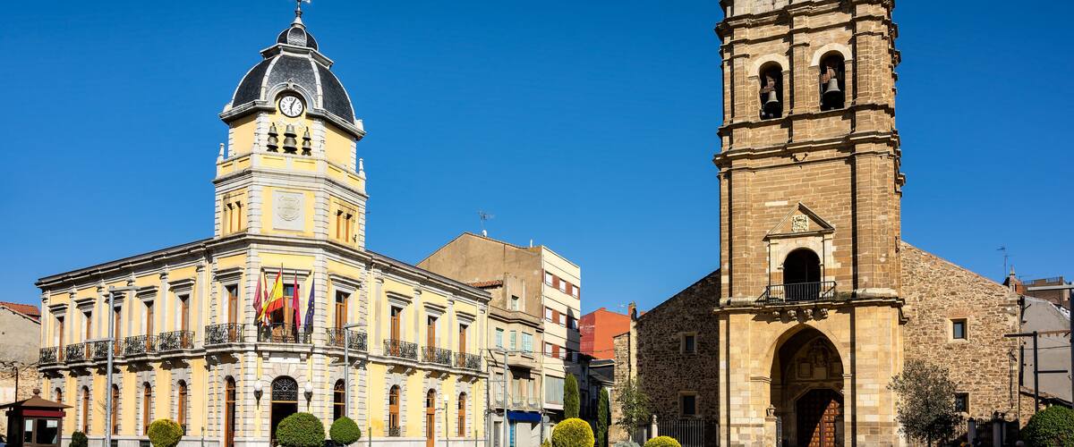 A historic building with a clock tower and a dome.