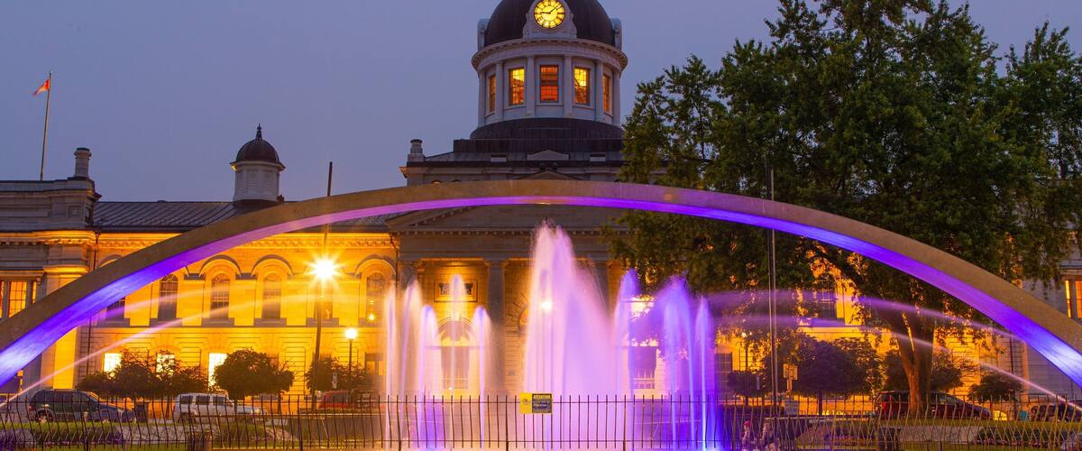 Kingston City Hall which includes heritage architecture, a fountain and night scenes