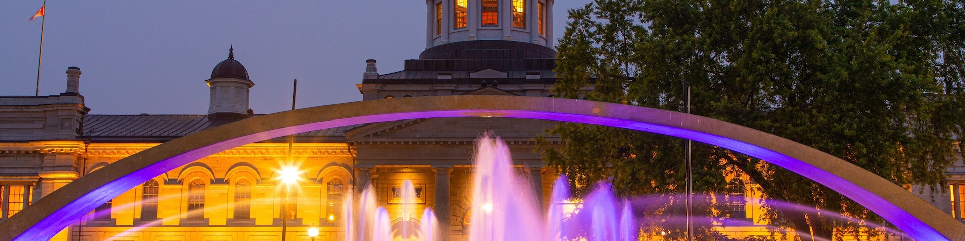 Kingston City Hall which includes heritage architecture, a fountain and night scenes