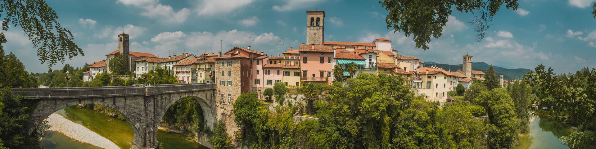 Horizontal photo of the town of Cividale del Friuli in Eastern italy on a picturesque sunny day. On picture visible also ponte del Diavolo above Nadige river.