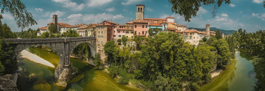 Horizontal photo of the town of Cividale del Friuli in Eastern italy on a picturesque sunny day. On picture visible also ponte del Diavolo above Nadige river.