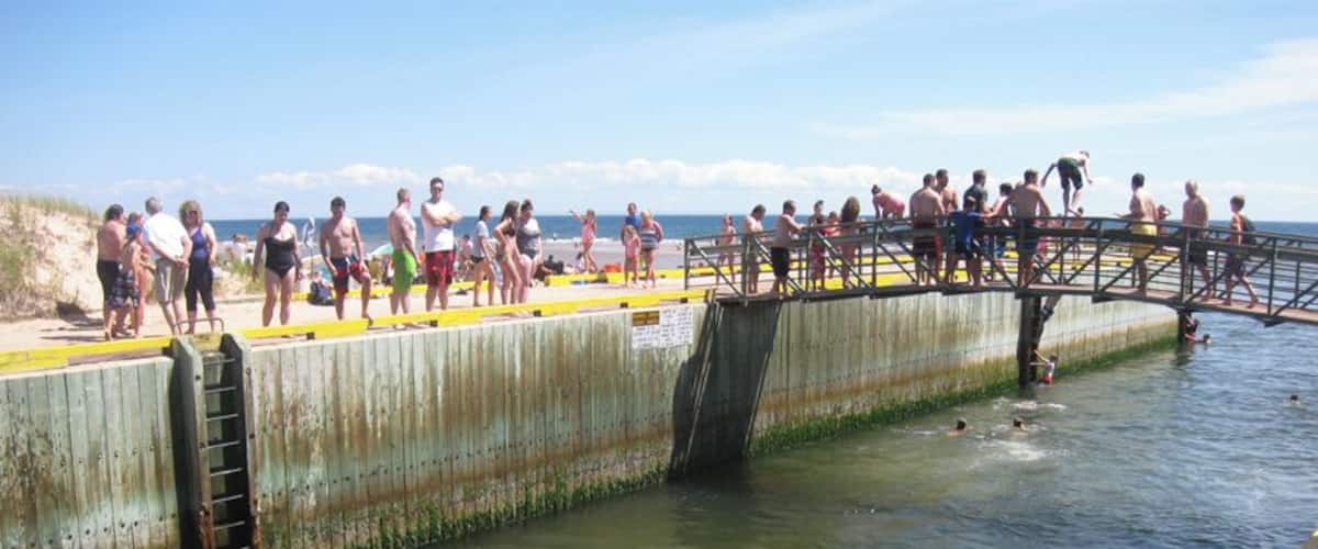 One of the best beaches on the island, Basin Head features "singing" sand, sandbars, and a popular bridge to jump off of (though signs note this is prohibited). #beachtips