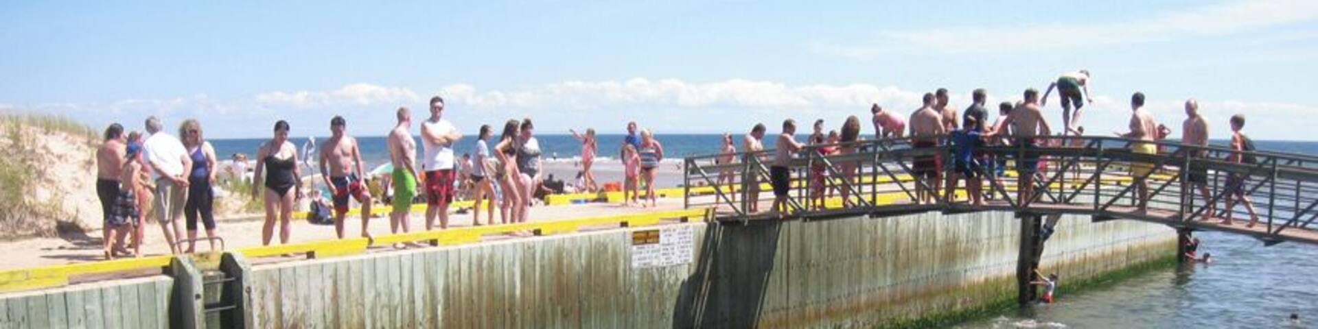 One of the best beaches on the island, Basin Head features "singing" sand, sandbars, and a popular bridge to jump off of (though signs note this is prohibited). #beachtips