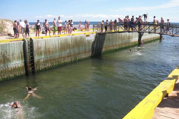 One of the best beaches on the island, Basin Head features "singing" sand, sandbars, and a popular bridge to jump off of (though signs note this is prohibited). #beachtips
