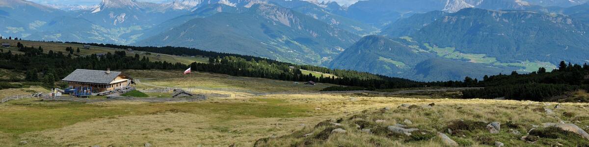 The Platzer mountain hut om the "Barbianer Alm" with the Dolomites of Val Gardena.