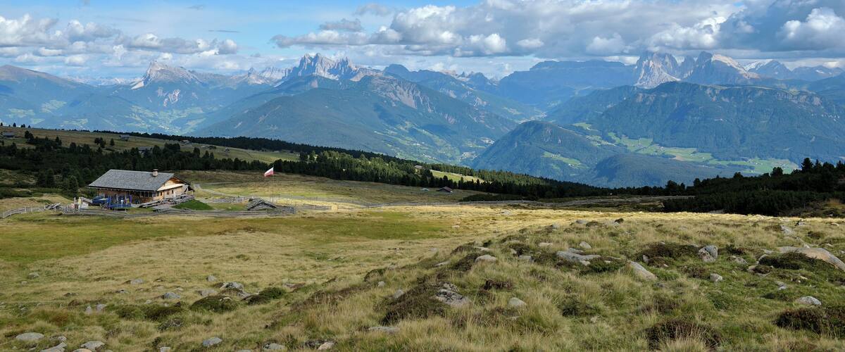 The Platzer mountain hut om the "Barbianer Alm" with the Dolomites of Val Gardena.