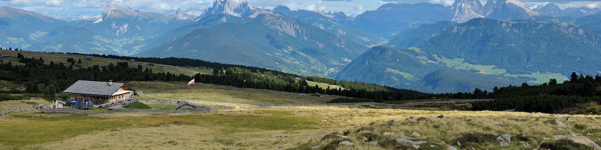 The Platzer mountain hut om the "Barbianer Alm" with the Dolomites of Val Gardena.