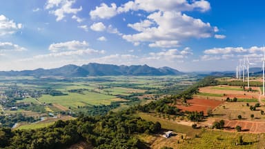 Panorama landscape of Wind turbine arranged in a row on a mountain with blue sky background in Sikhio District, Nakhon Ratchasima, Thailand