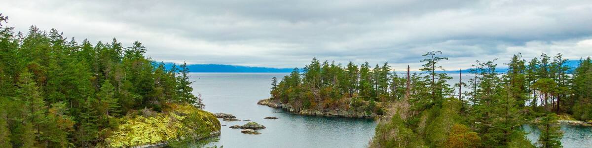 Smuggler Cove Marine Provincial Park showing island views, landscape views and a lake or waterhole