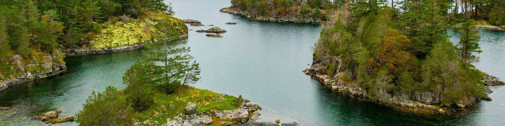 Smuggler Cove Marine Provincial Park showing island views, landscape views and a lake or waterhole
