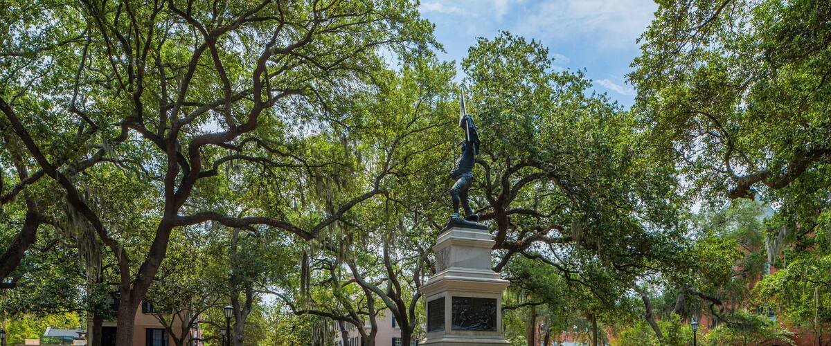 Madison Square which includes a park and a statue or sculpture
