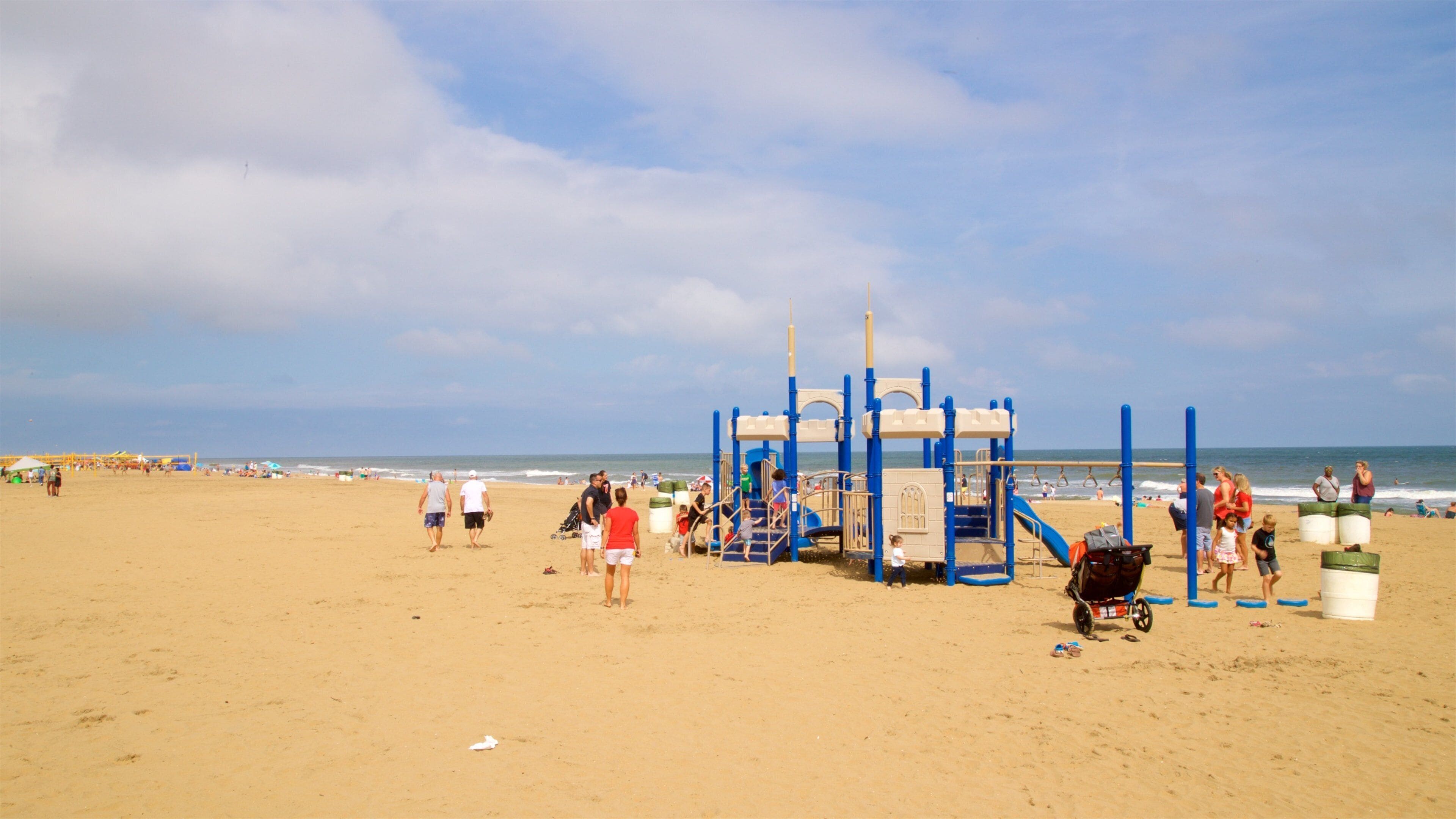 Neptune\'s Park which includes general coastal views and a sandy beach as well as a small group of people