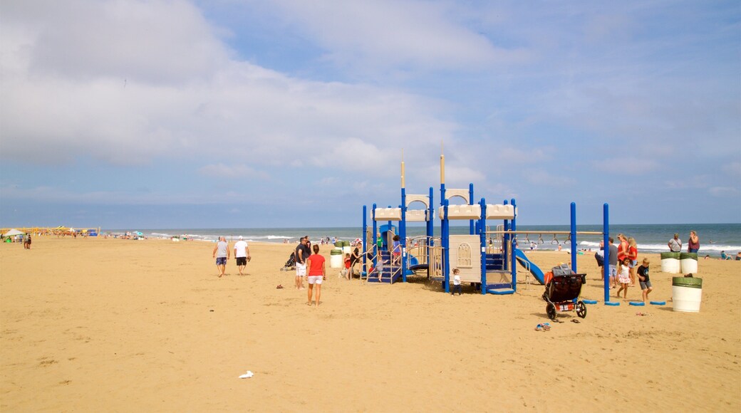 Neptune\'s Park which includes general coastal views and a sandy beach as well as a small group of people