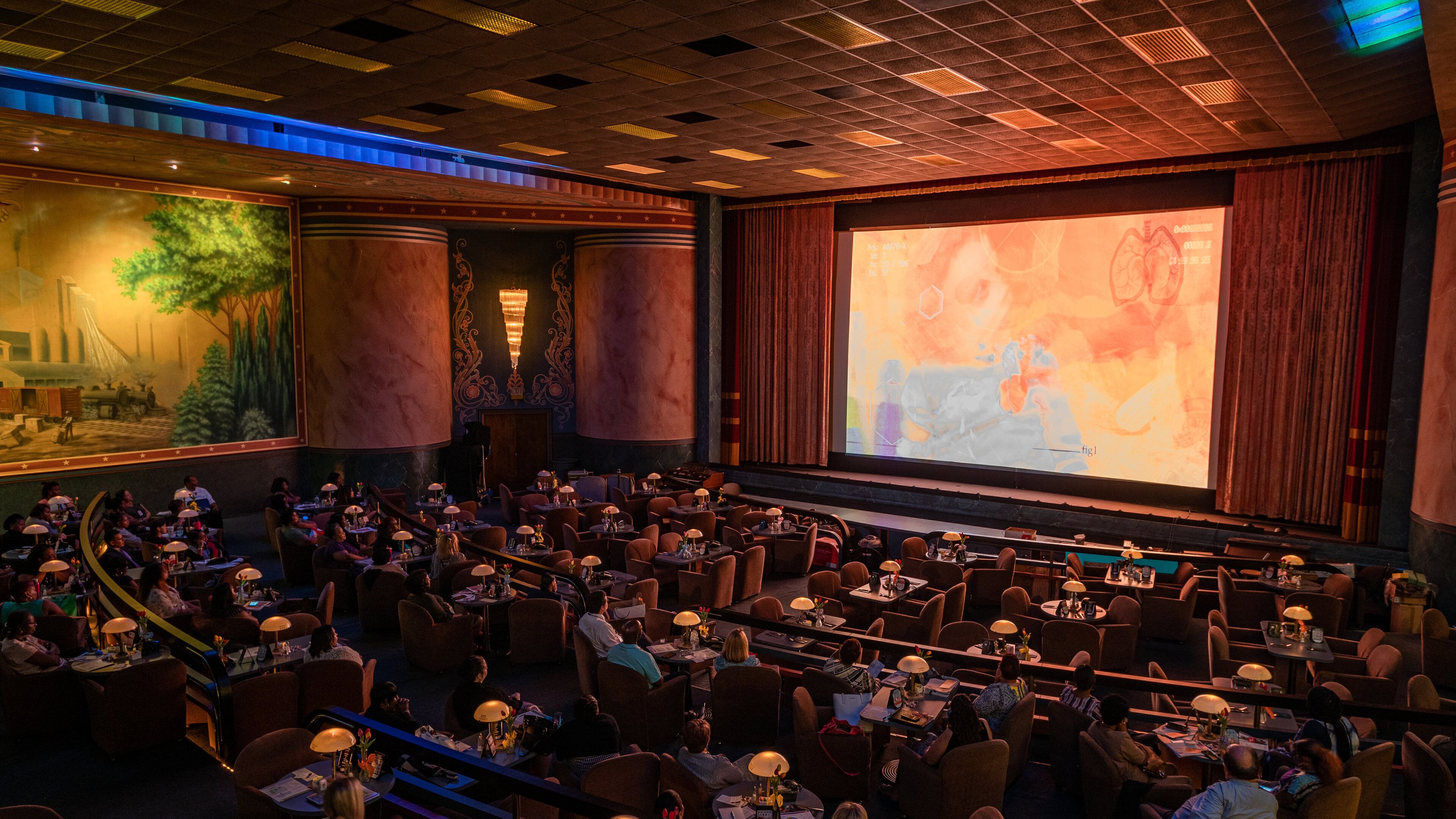 Commodore Theatre showing theater scenes and interior views as well as a large group of people