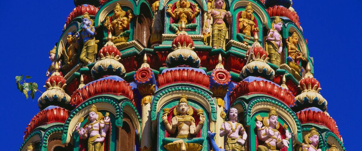 A colorful temple with intricate carvings and statues.