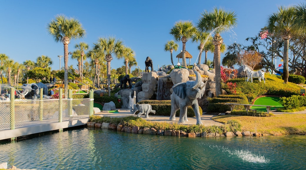 Coconut Creek Family Fun Park featuring a fountain, a garden and outdoor art