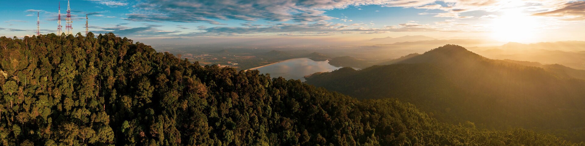 Aerial view of Bukit Mertajam Hills and Mengkuang Dam during sunrise. Located at Bukit Mertajam, Penang.