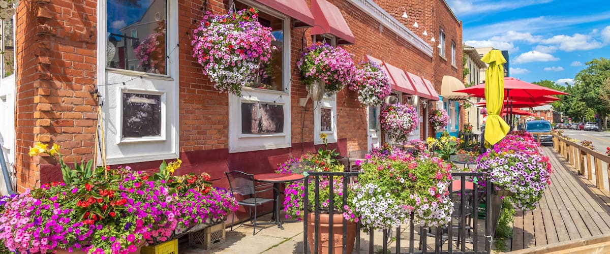 Red brick city hall with a clock tower in the scenic historic center in Stratford, Ontario .