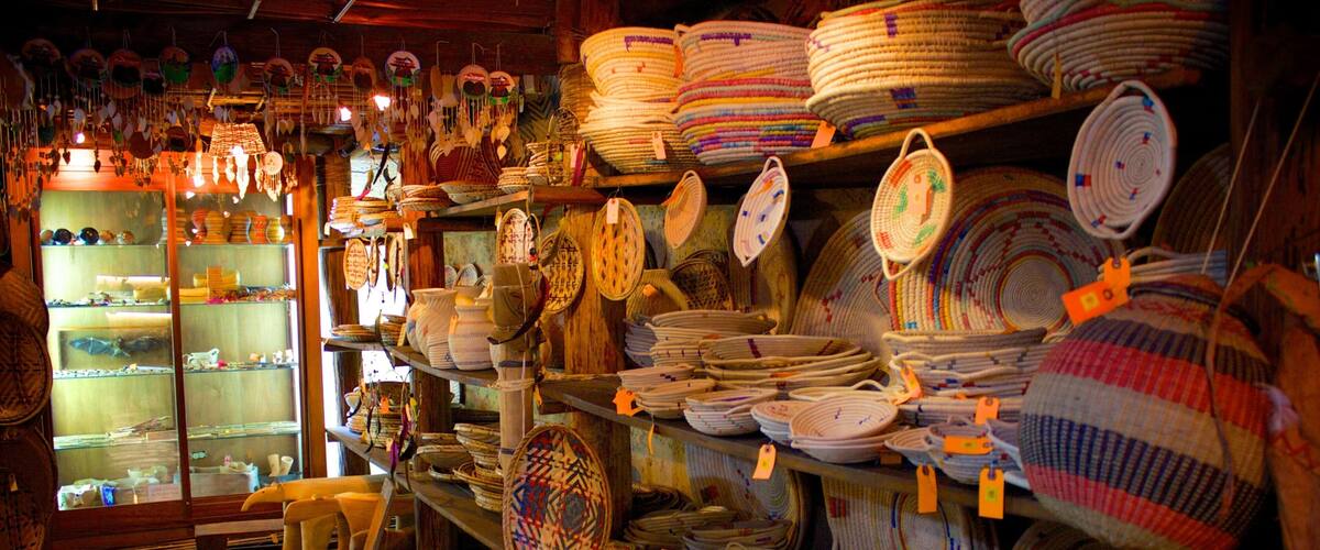 A store with shelves full of woven baskets and pottery.