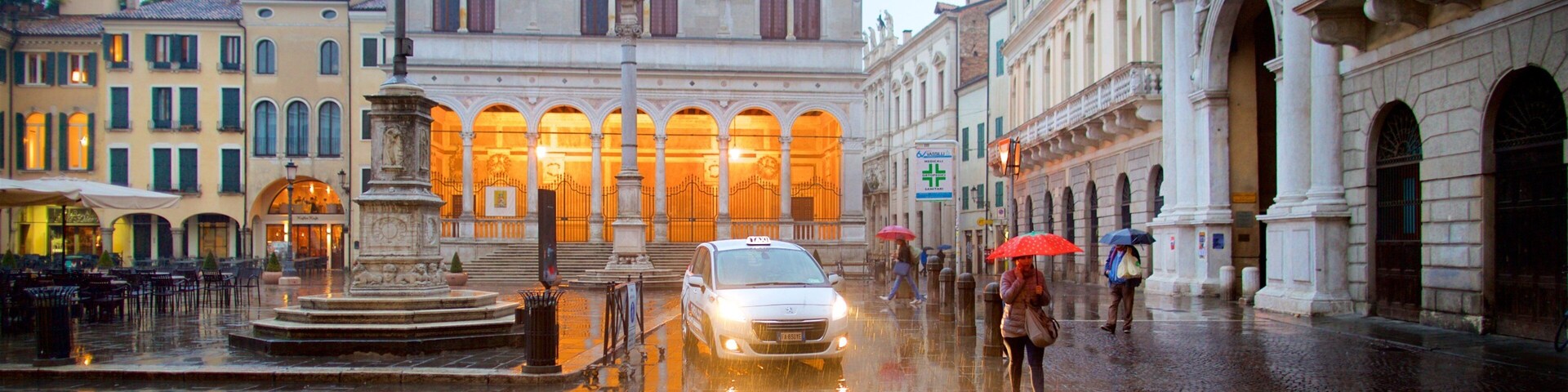 Piazza dei Signori featuring a fountain, heritage architecture and a square or plaza