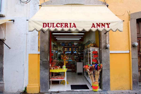 A shop named Dulceria Annie with colorful items displayed outside.