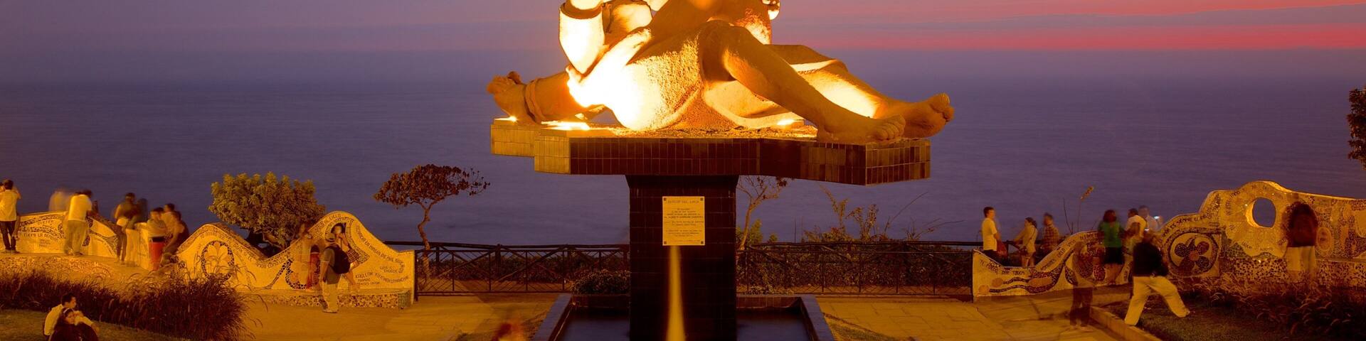 Parque del Amor which includes night scenes, a sunset and outdoor art
