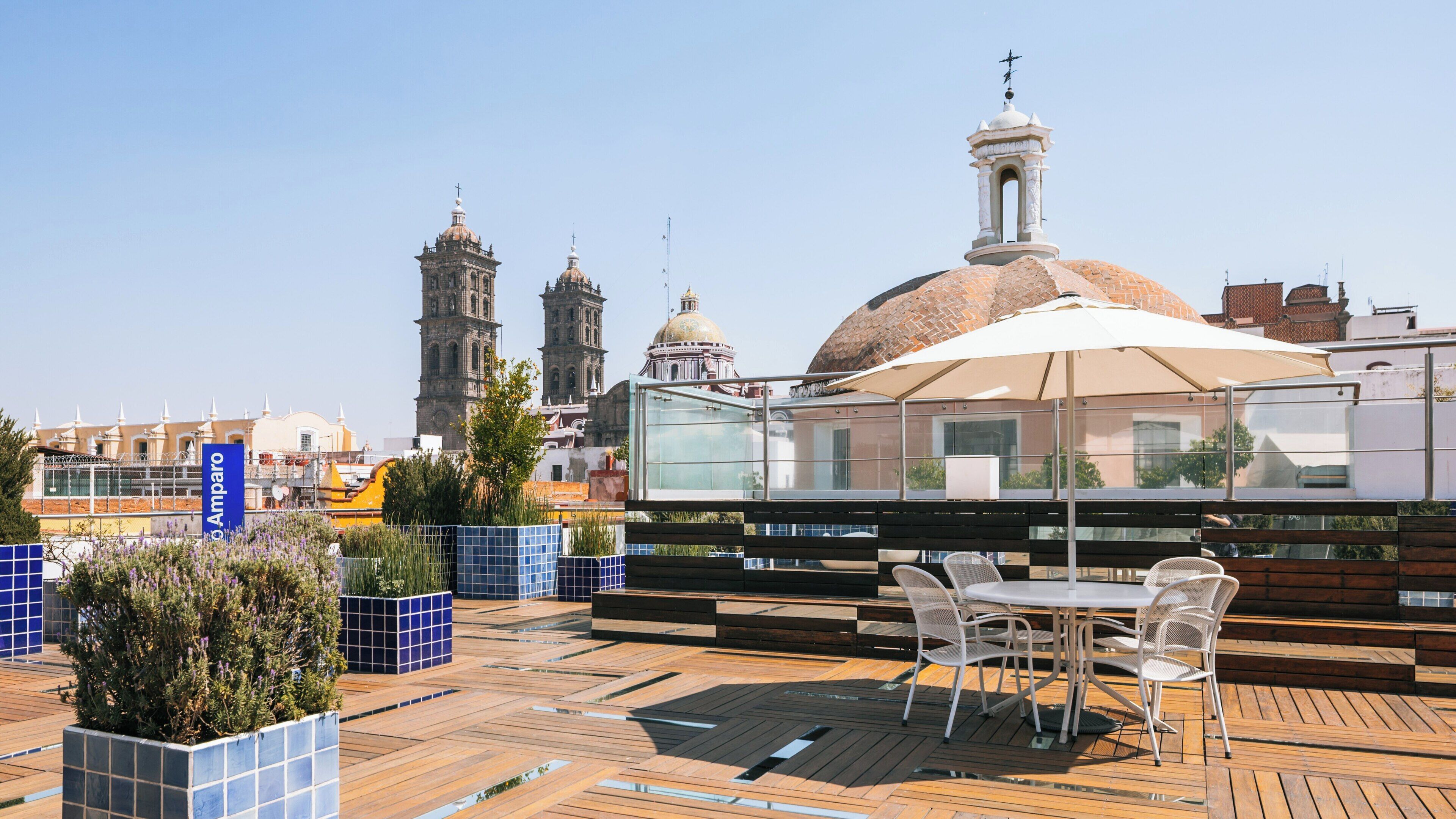 Exploring the rooftop views from Amparo Museum in Puebla Historic Center with historic architecture in the background