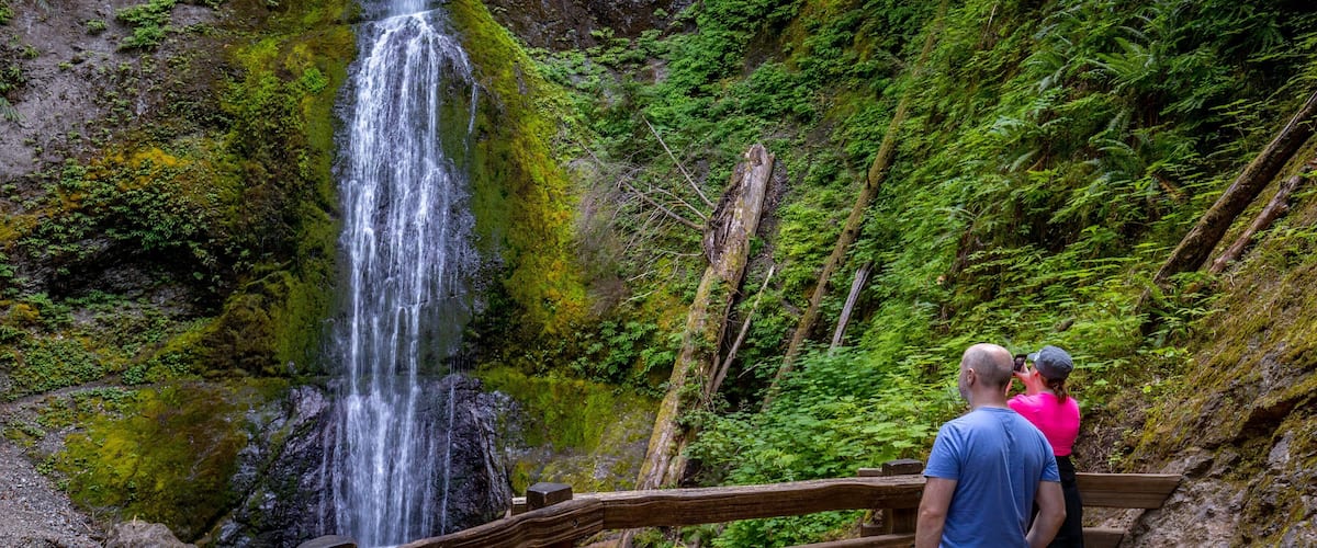 Marymere Falls which includes a waterfall as well as a couple
