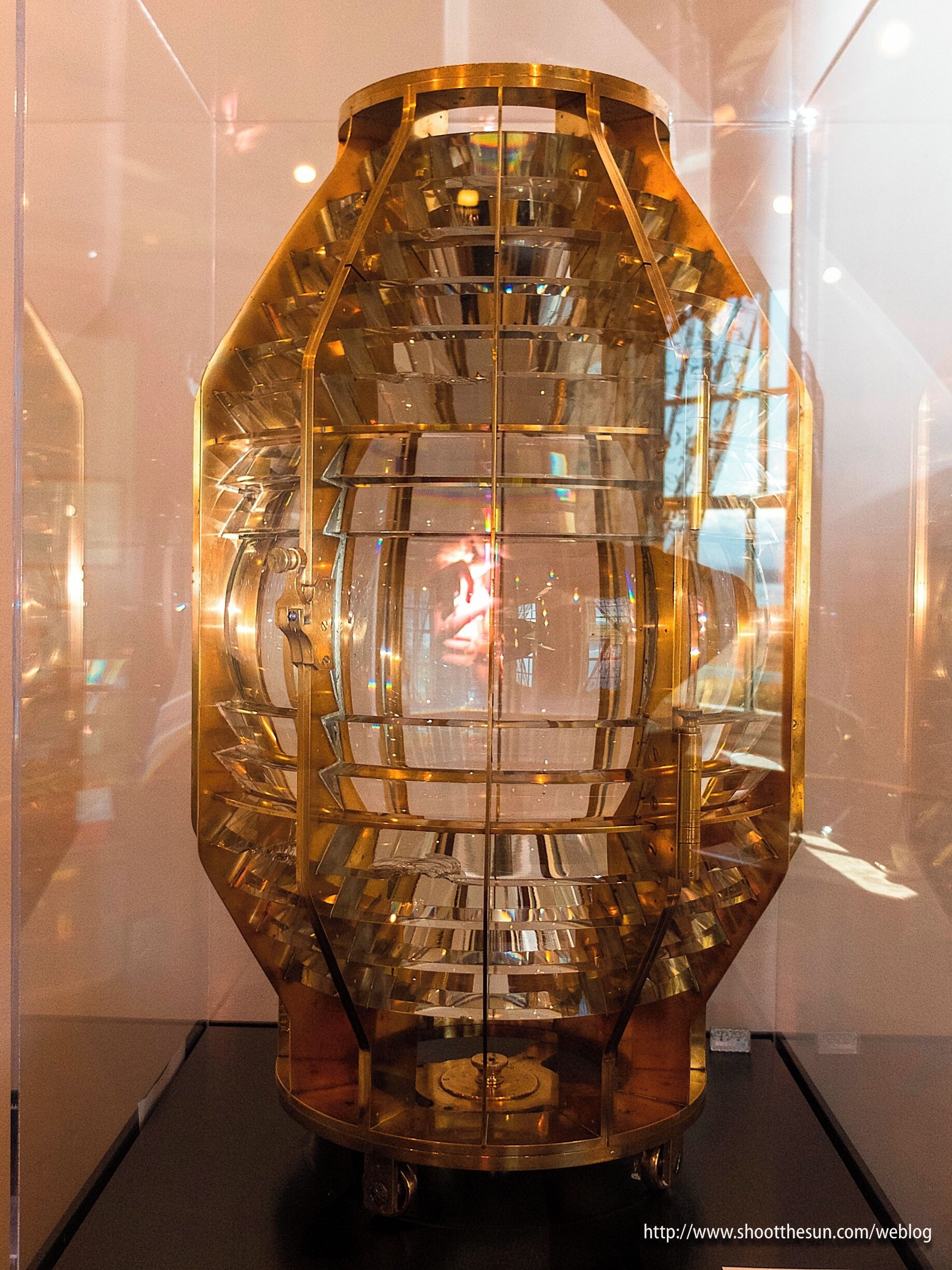 The plaque reads:

4th Order Fresnel Lens
Manufactured by
Macbeth-Evans Glass Company
Pittsburgh, Pennsylvania
Circa 1913
On loan from the U.S. Lighthouse Society

And I doubt I need to say anything else.