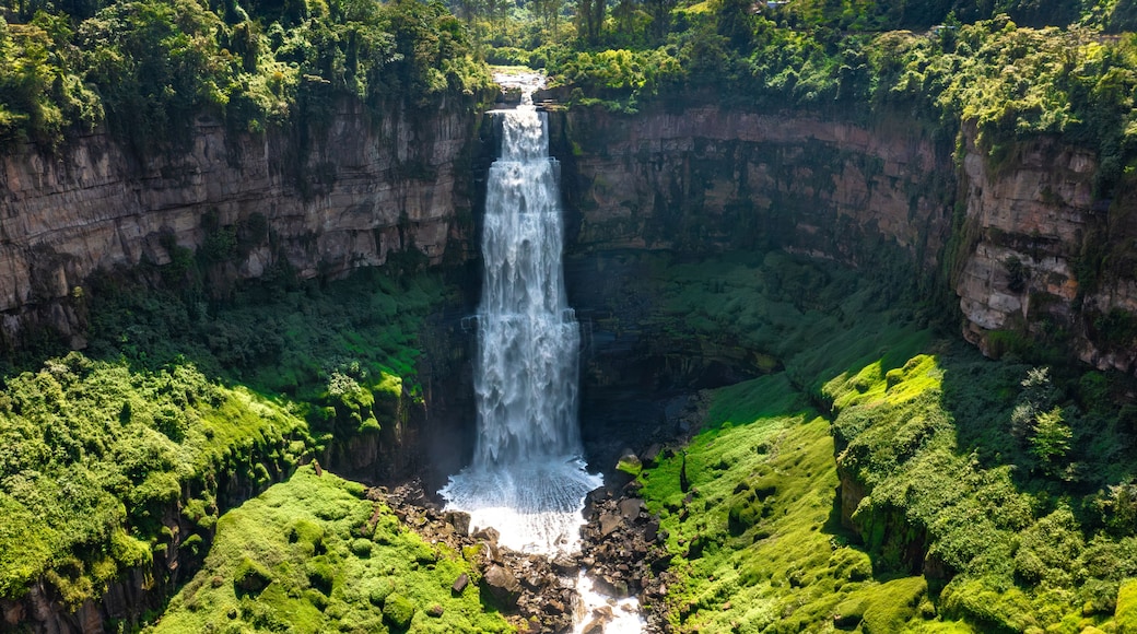 Panoramic view of Tequendama Falls waterfall plunging into vast green canyon near Bogota Colombia landscape