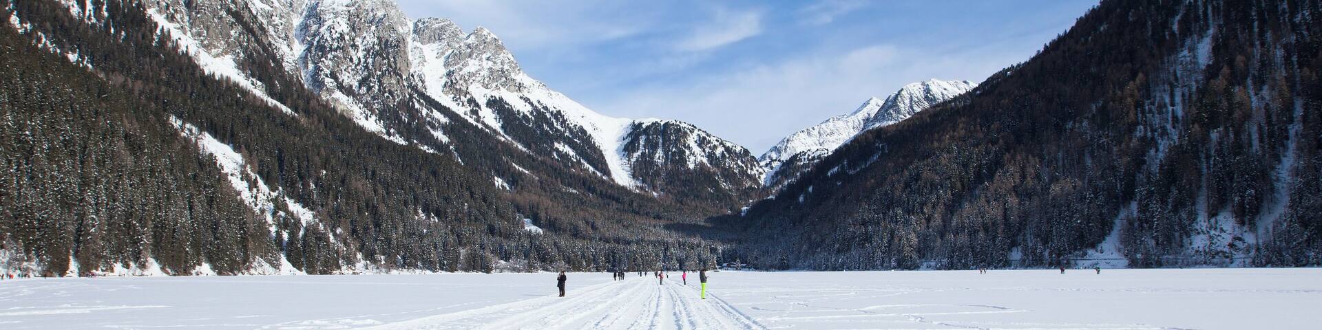 Frozen lake Antholz Anterselva in Italian alps winter, Tirol, Italy