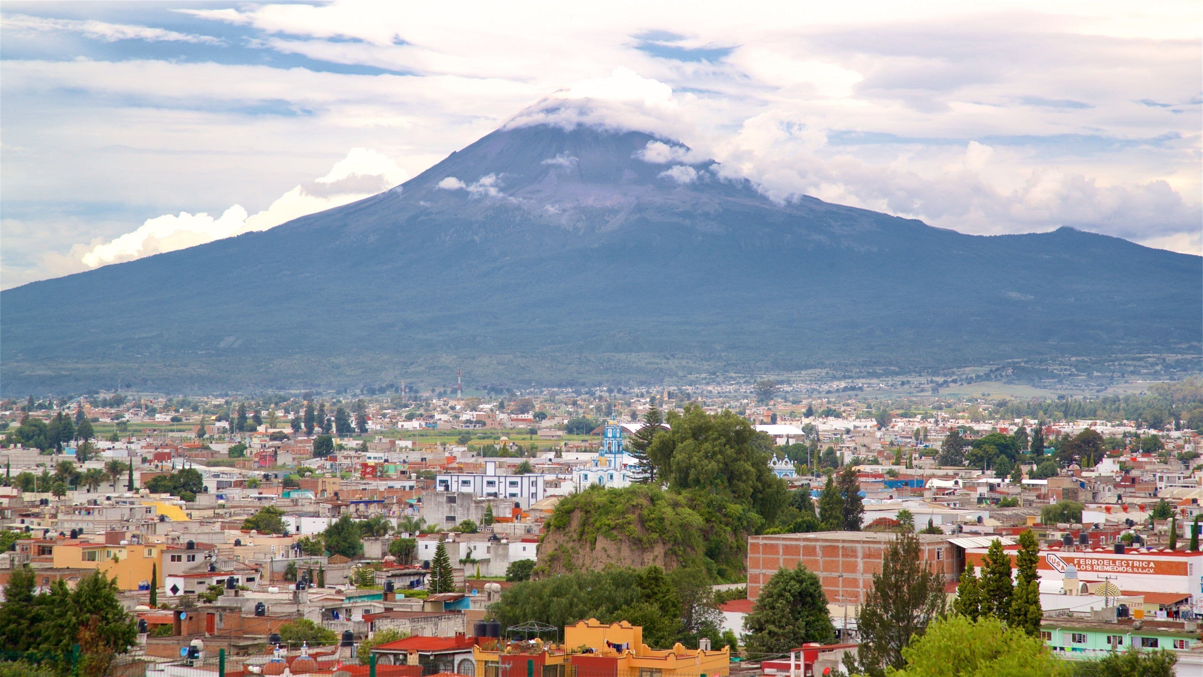 La Virgen de los Remedios Sanctuary featuring landscape views, mountains and a city