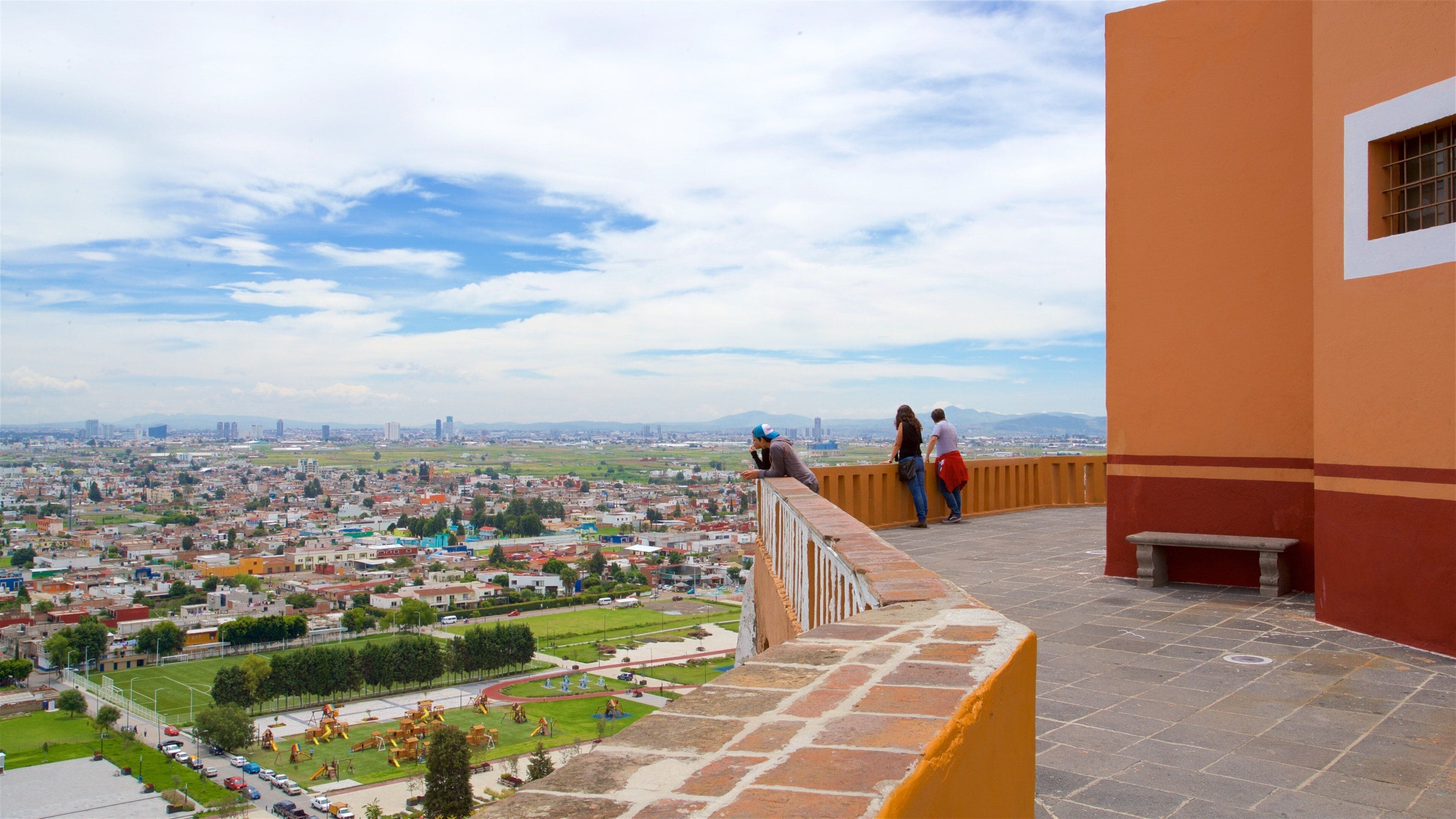 La Virgen de los Remedios Sanctuary which includes a city, landscape views and views