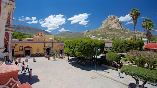 Bernal which includes a square or plaza, mountains and tranquil scenes