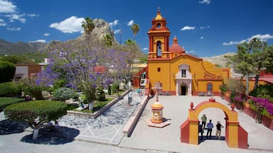 Bernal showing mountains, a church or cathedral and tranquil scenes