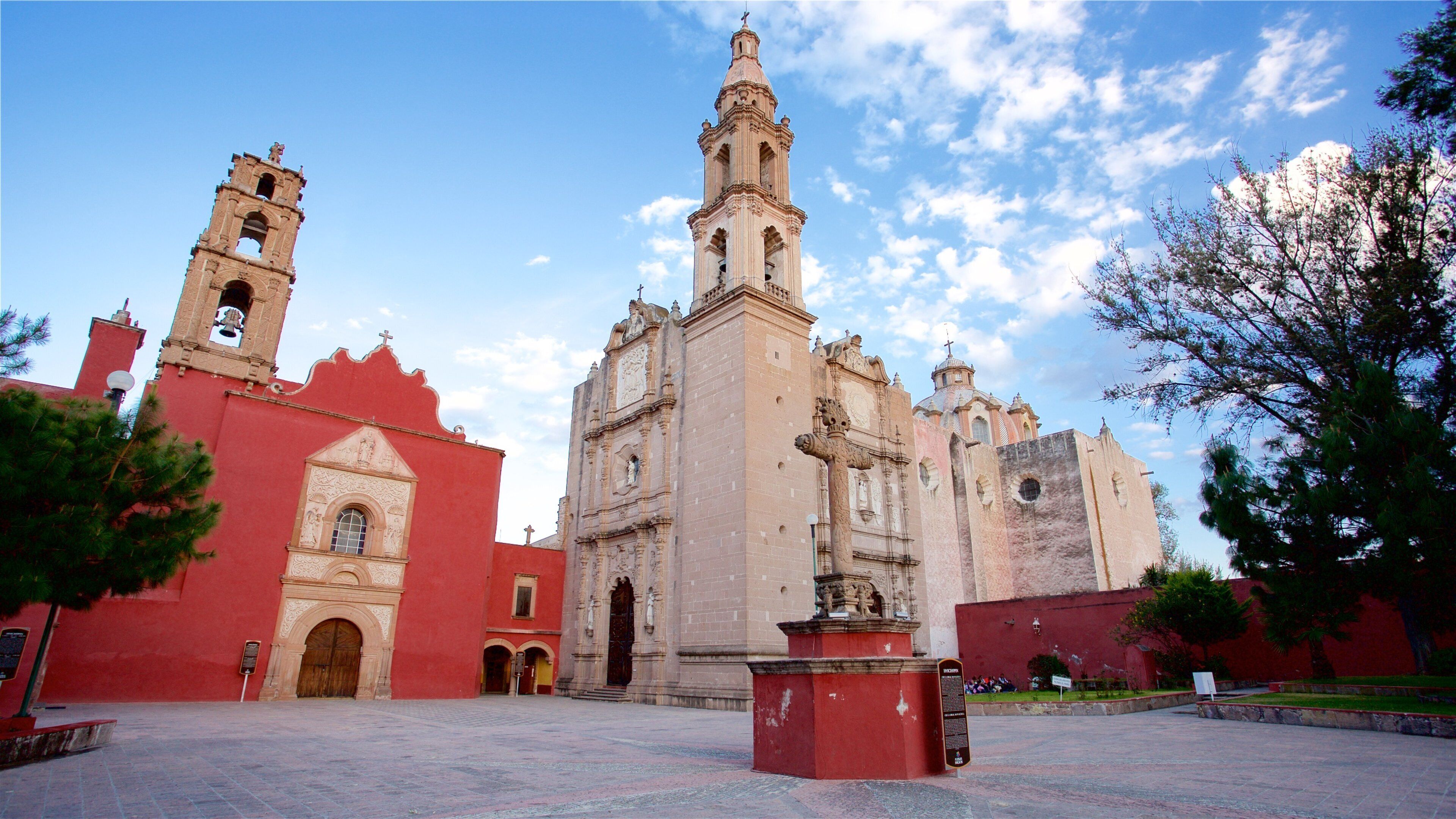 A historic church with a bell tower and a large central tower.
