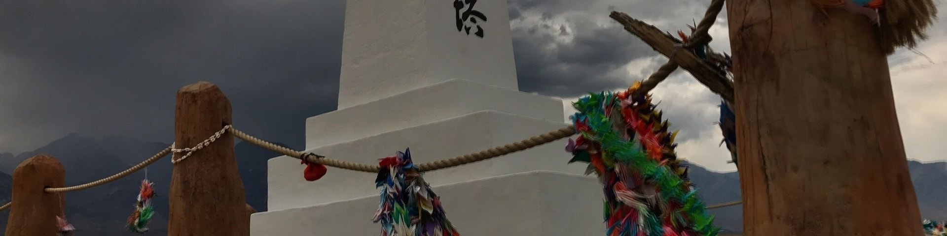 For years I've driven past Manzanar on the way up to Mammoth. Traveling solo this time, I decided to stop. Hiking back the mile or so through the scrub in the searing heat, the only sounds were the crunch of my footsteps and the wind coming down off the Sierras which gave scale to the isolation of the place. The simplicity of the monument, quiet rustling of the prayer flags, and darkness of the oncoming storm lent a brooding element, adding to the feeling of humbleness and sorrow.