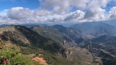 A mountainous landscape with rugged terrain and a clear sky.