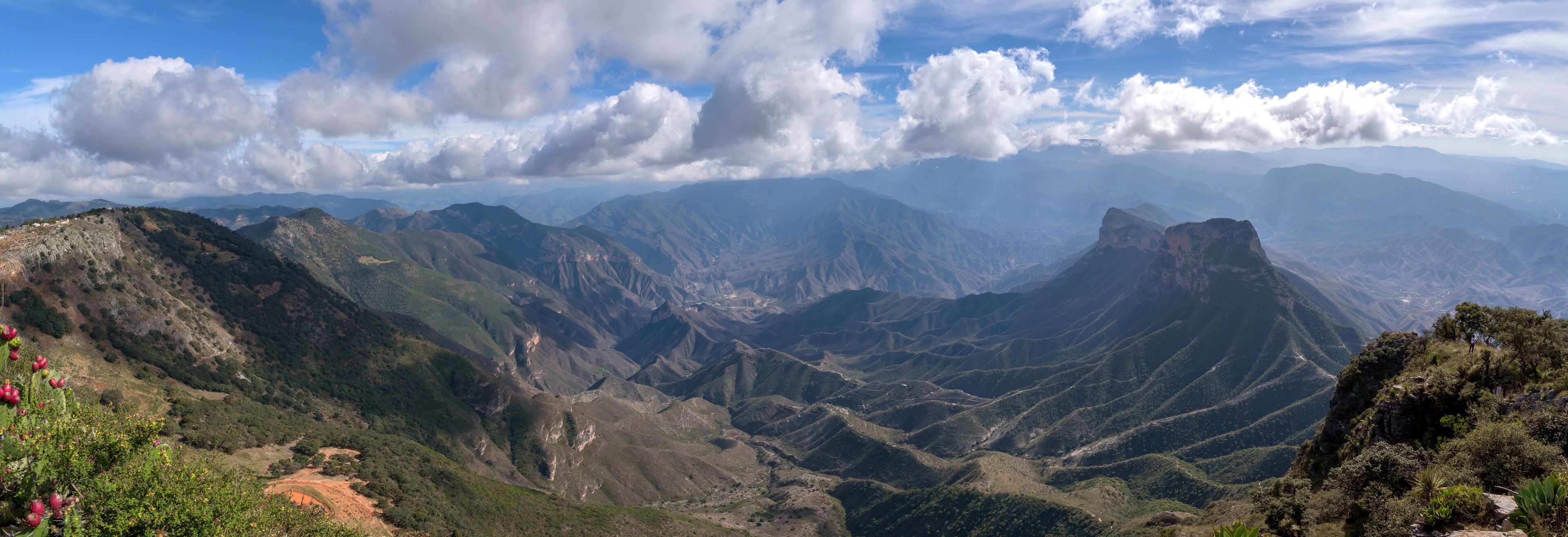 A mountainous landscape with rugged terrain and a clear sky.