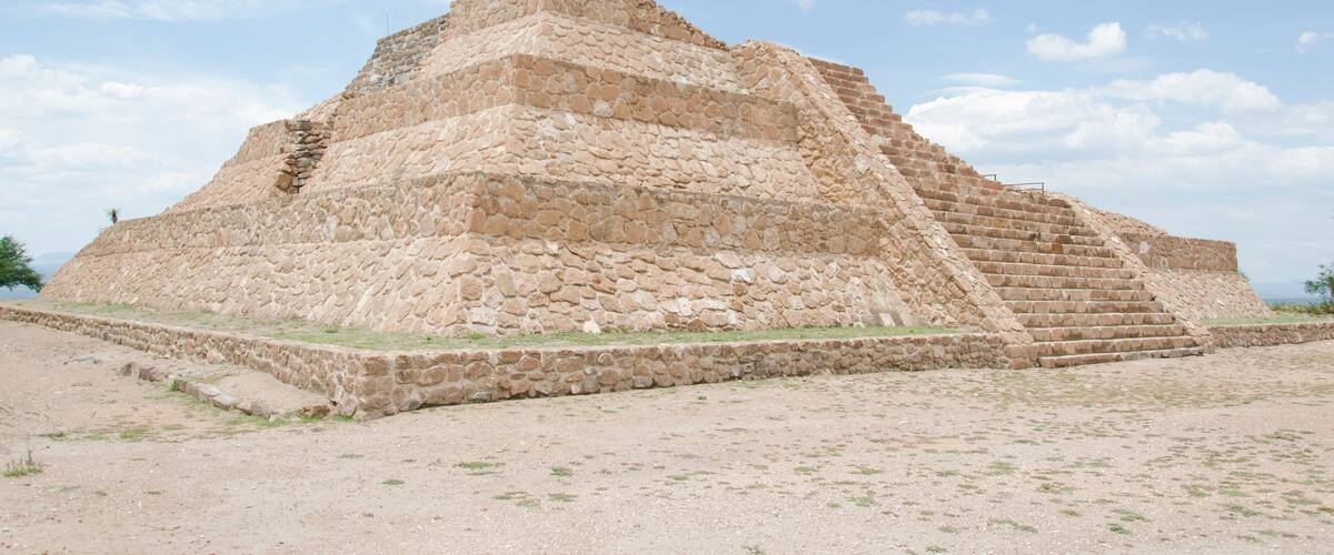 A large stone pyramid with a stepped structure.