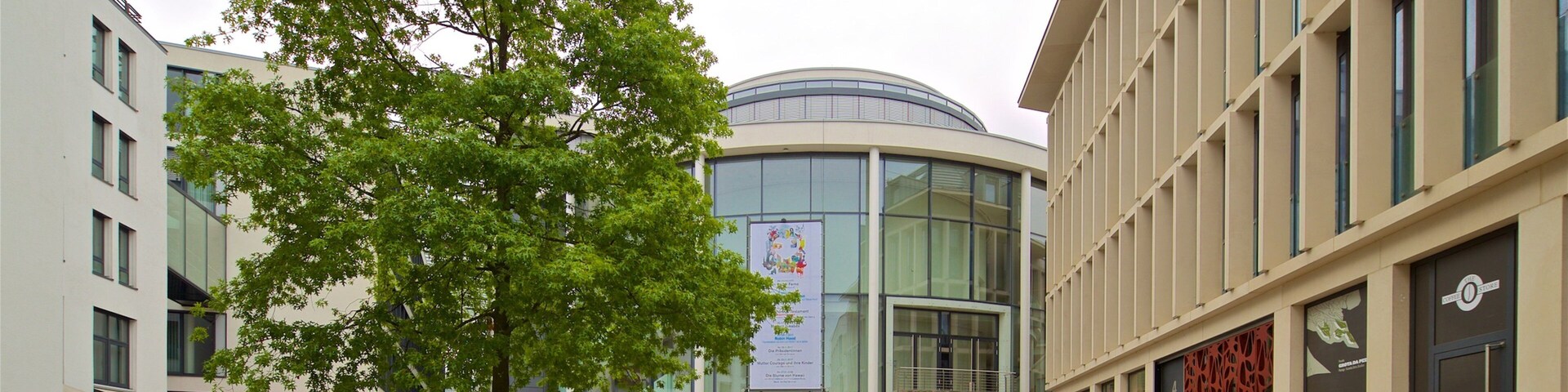 Theater Paderborn featuring modern architecture, street scenes and cycling