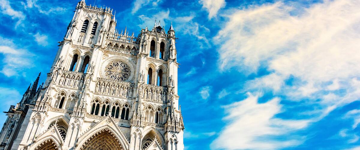 A Gothic cathedral with intricate architecture and a large rose window.