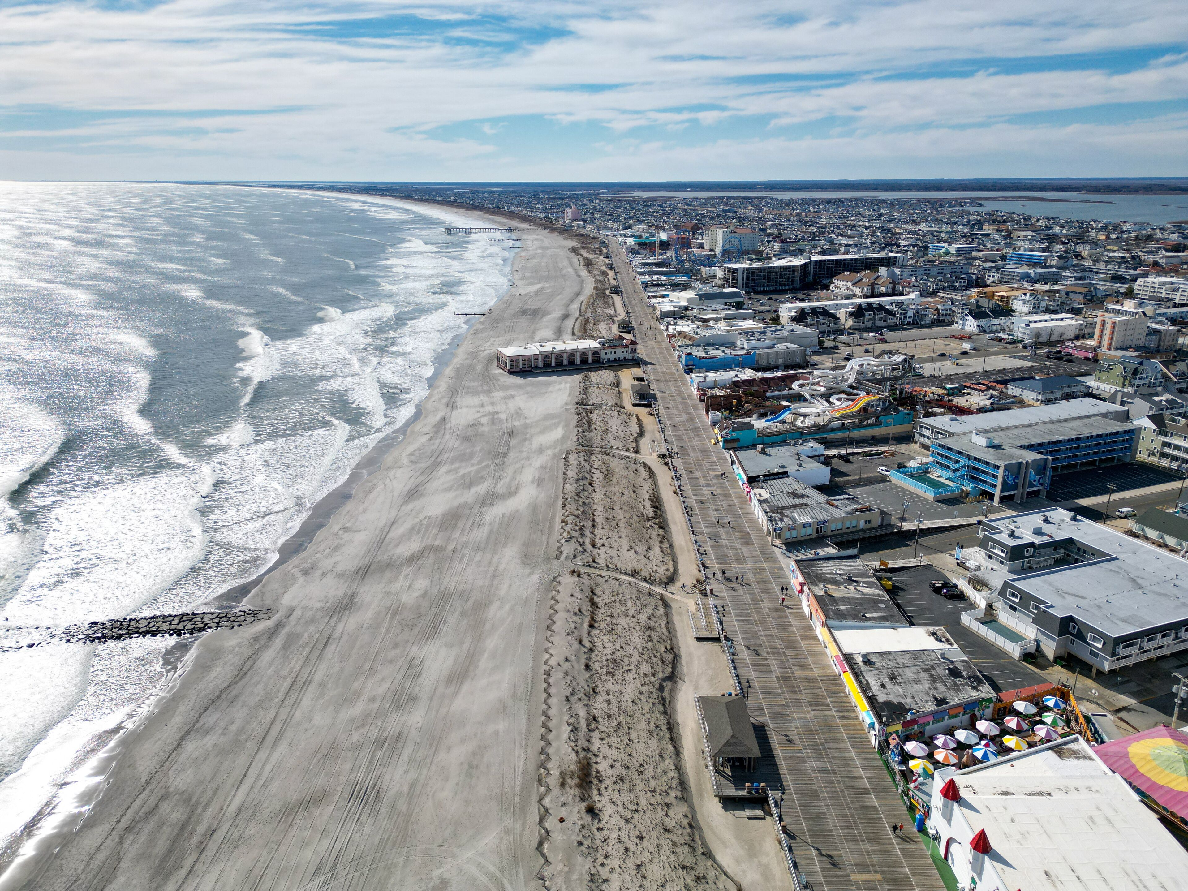 Aerial view of the Ocean City, New Jersey boardwalk and beach with the Music Pier seen